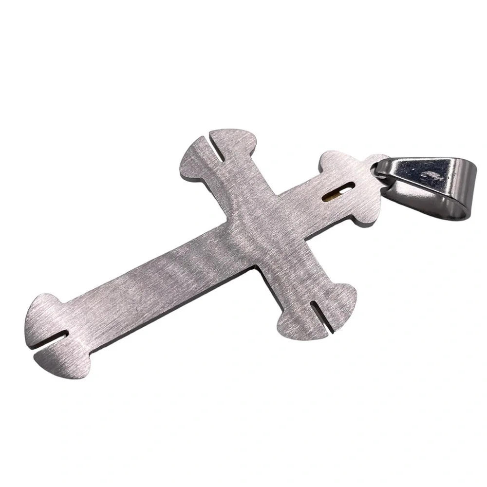 Silver and gold colored cross pendant